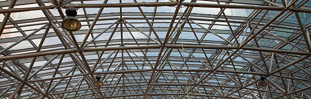 istock Glass roof with metal structure in perspective 453440397