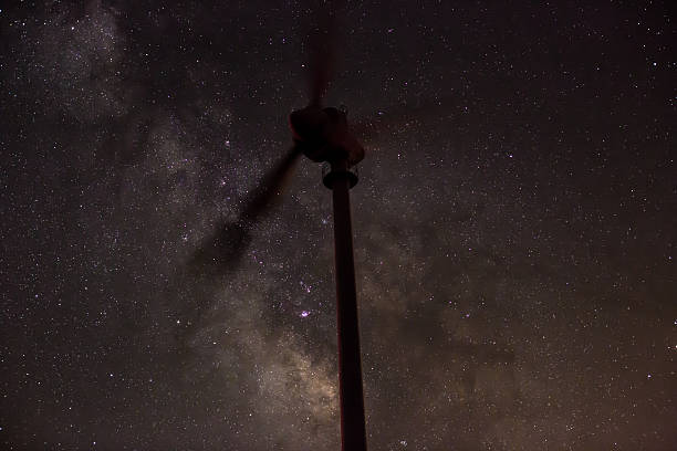 istock wind turbine with milky way 453441103