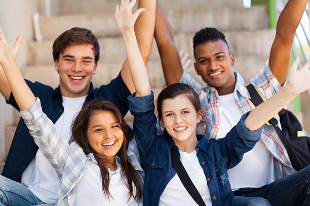 istock excited high school students with arms outstretched 453441669