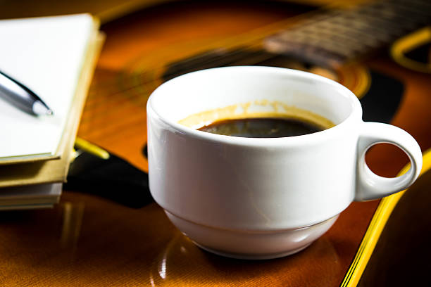 istock Acoustic guitar with a cup of coffee 453442329