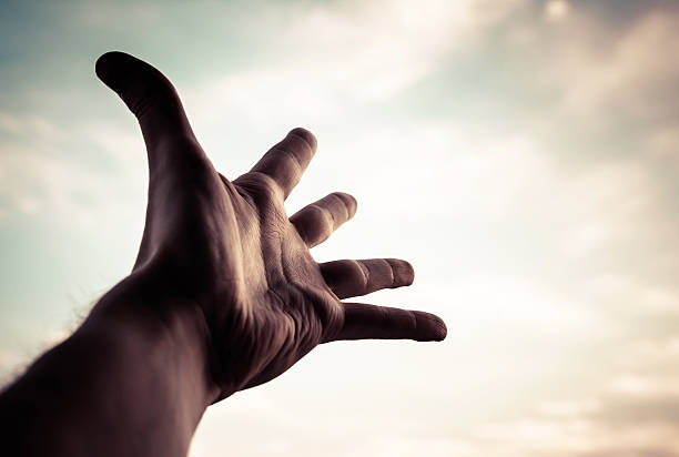 istock Hand of a man reaching to sky. 453443311
