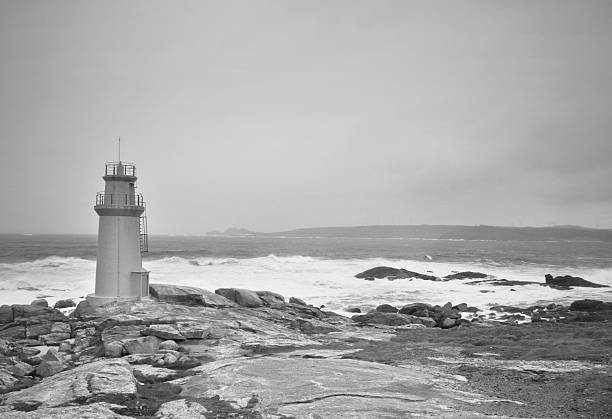 istock Stormy sky over a lighthouse in black and white Spain 453446561