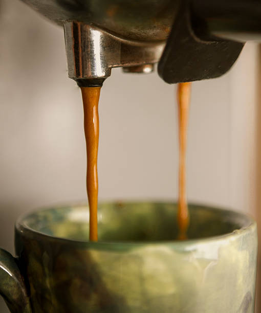 istock Espresso dripping out of portafilter into a cup 453448075