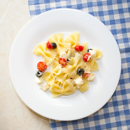 Pasta ribbons, cherry tomatoes and olives
