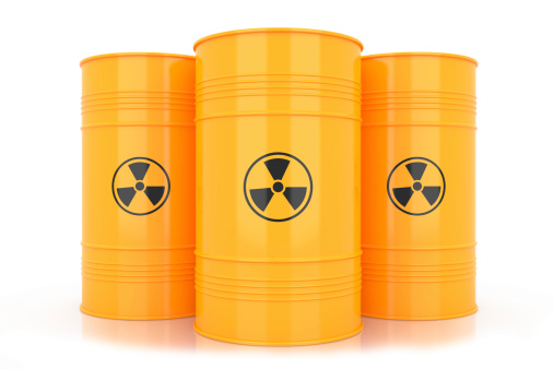 Isolated on white background. Yellow barrels with radioactive waste