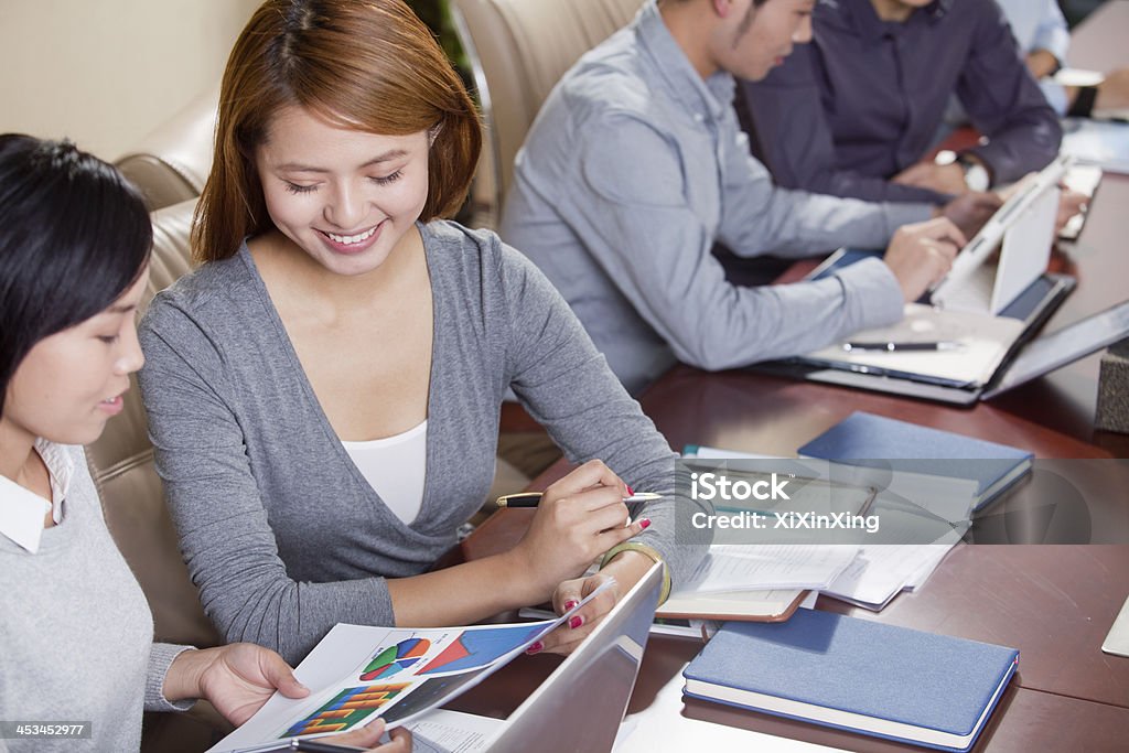 Businesspeople Working Together 20-24 Years Stock Photo