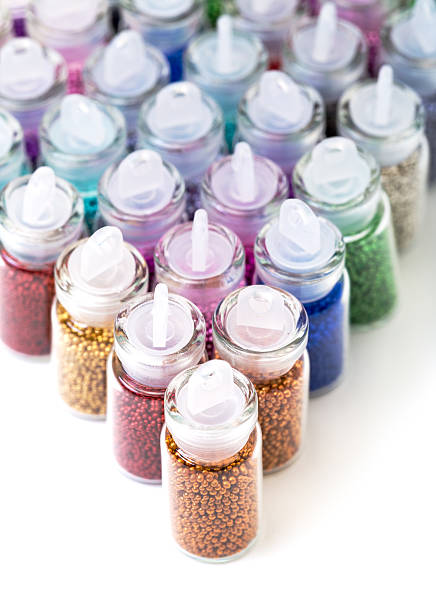 istock Small Glass Jars filled with Balls of Bead 453453331