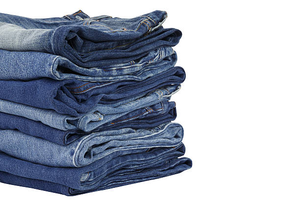 istock lot of blue jeans isolated on white background 453465845