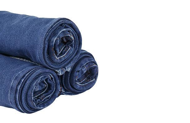 istock lot of blue jeans isolated on white background 453466615