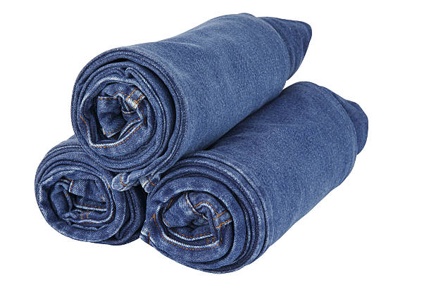 istock lot of blue jeans isolated on white background 453466617