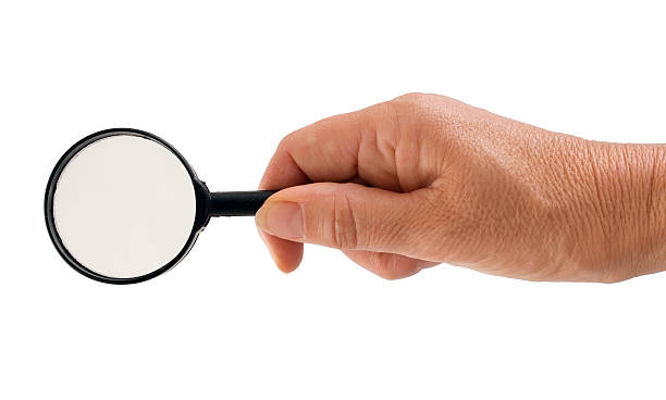 istock Woman seeking solution - hand with magnifying glass isolated ove 453466991