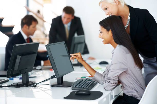 istock Busy businesspeople working together at office 453469221