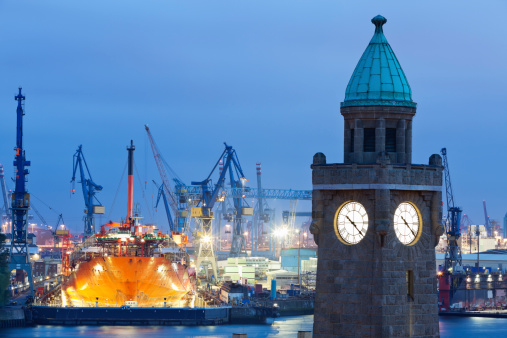 Clock Tower of Elbtunnel and Shipyard at Dusk, Hamburg Harbor