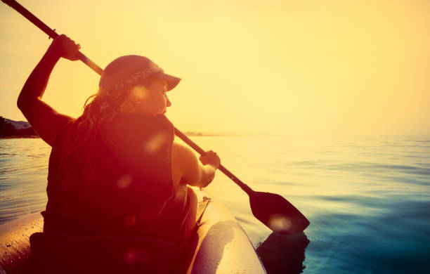 istock Riding a kayak on sea at sunset 453469535