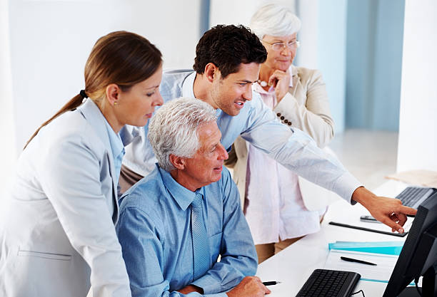 istock Group of businesspeople working together on business project 453471405