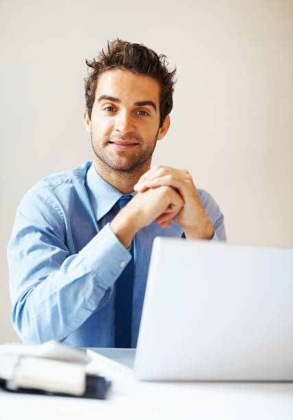 istock Executive listening while in front of laptop 453471955