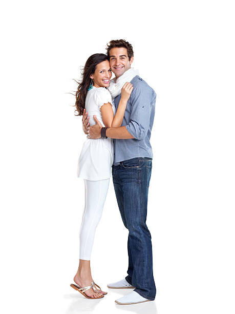 istock Happy young couple embracing each other on white 453472129
