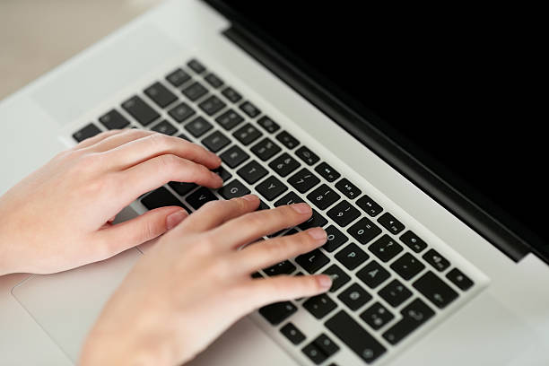 istock Female hands on keyboard of laptop 453472369