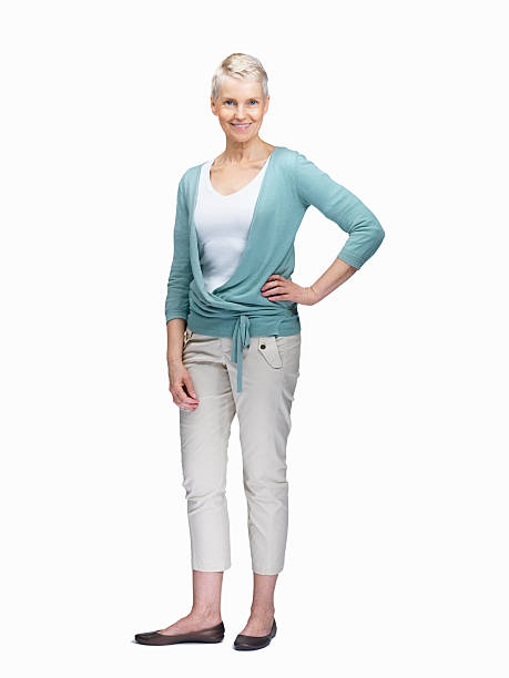 istock Full length image of happy mature female posing on white 453472811