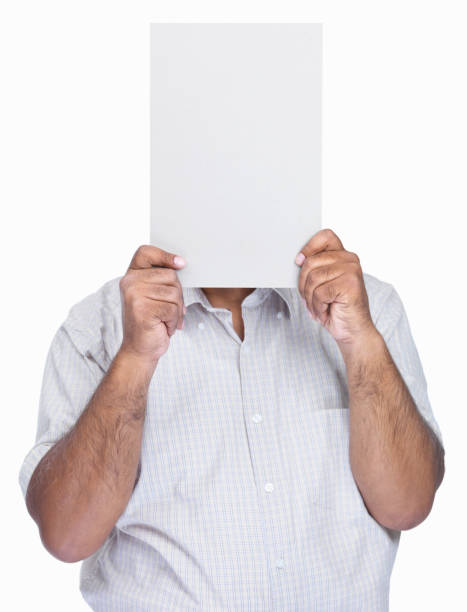 istock Man holding an empty billboard in front of face 453473063