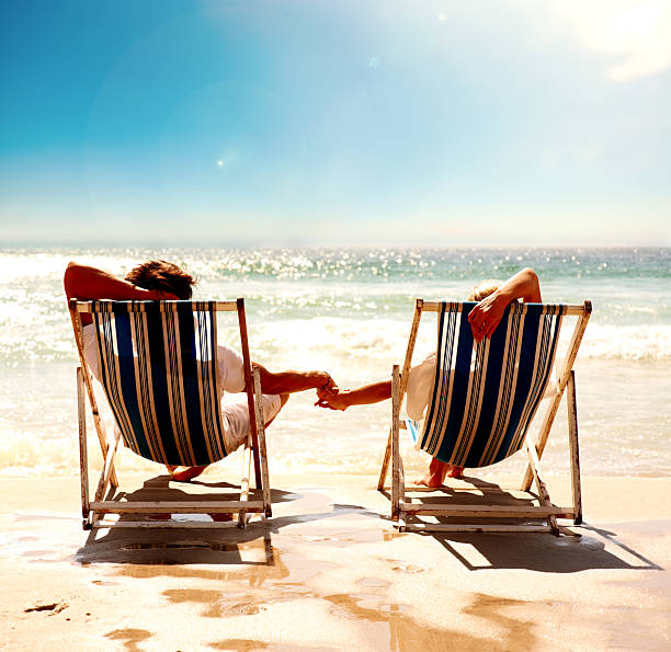 istock A couple resting on the deck chairs 453473415