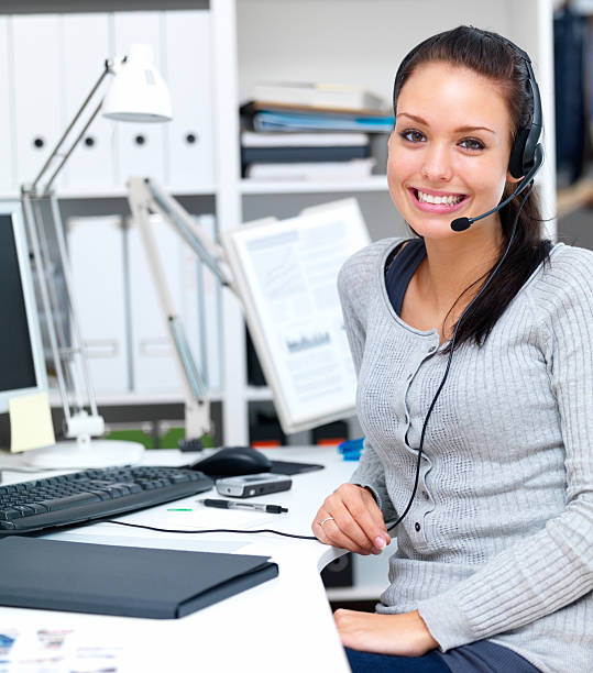 istock Closeup of a woman working on computer and wearing headphones 453473709