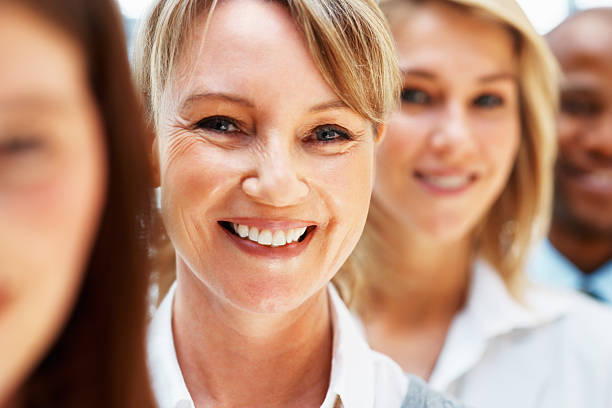 istock Woman surrounded by colleagues 453477987
