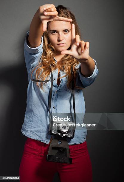 Photographer Woman Looking For Frame Using Hands With Old Camera Stock Photo - Download Image Now