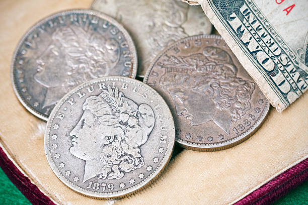istock US Silver Dollar Coins and 1928 Two Dollar Bill 453480071
