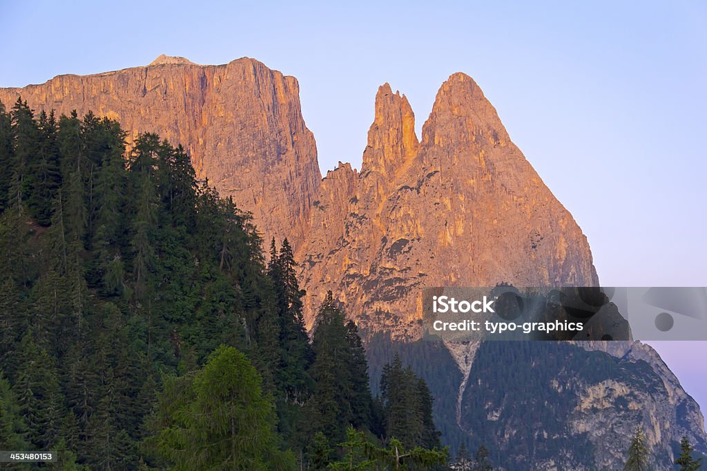 Schlern Massif, Santner Spitze Schlern Massif, Santner Spitze in the morning light. (Italian Siciliar. Santner Spitze is a peak at the north west end of the Schlern mountain massif in the Dolomites (South Tyrol, Italy). The Dolomites are part of Southern Limestone Alps in Europe. In August 2009, the Dolomites were declared a UNESCO World Heritage Site. Alto Adige - Italy Stock Photo