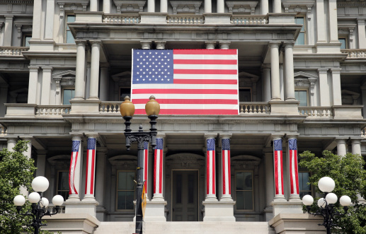 Eisenhower Executive Office Building in Washington DC with American Flag Displayed