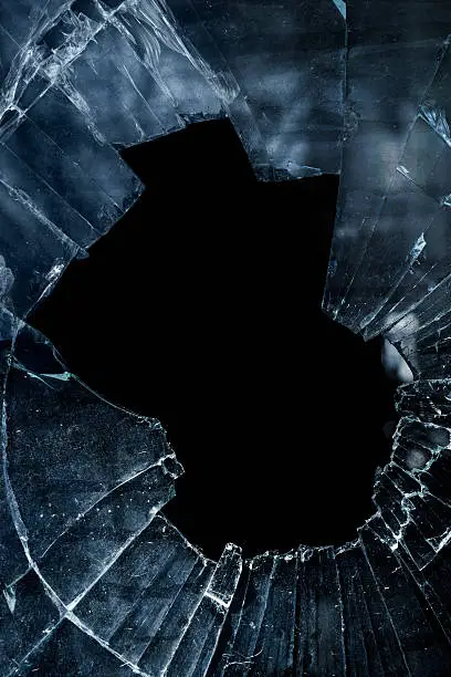 Broken glass with dark background 