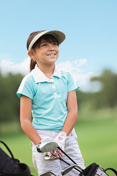istock Cute preteen golfer playing golf on green course 453481559