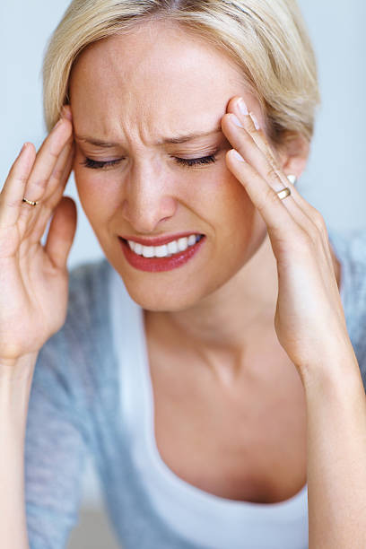 istock Woman suffering from head pain 453484737