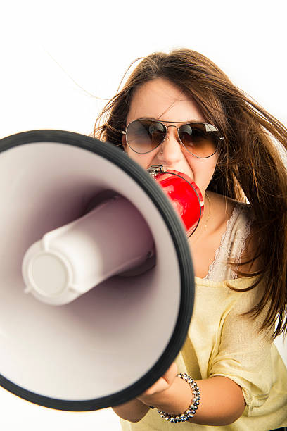 istock Young woman with a megaphone 453485015