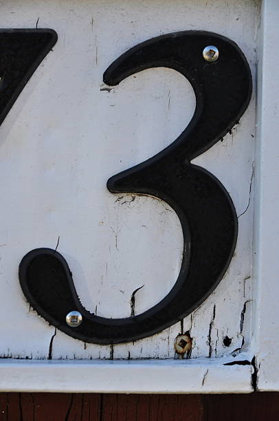 istock Street address black number 3 on white background with screws 453487587