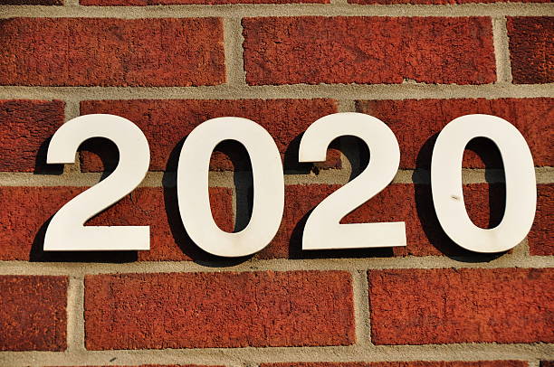 istock Street address white number year 2020 future on brick wall 453488203