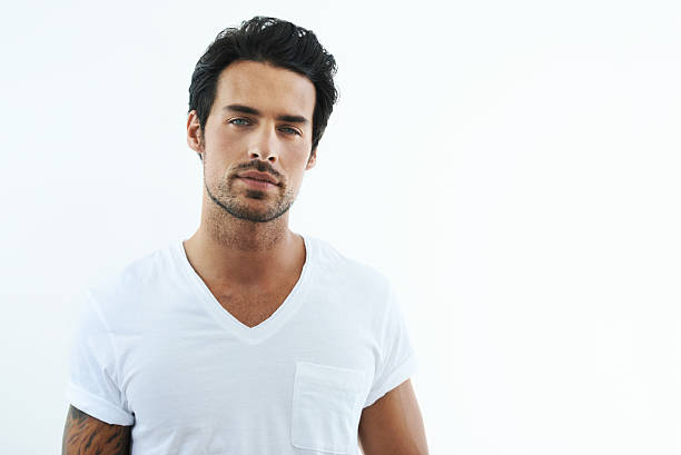 I make this shirt look good! Shot of handsome man wearing a white t-shirt sex symbol stock pictures, royalty-free photos & images