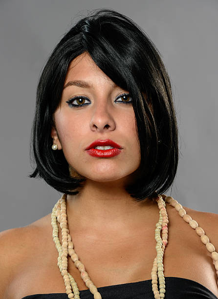 istock Serious young woman portrait on gray background 453490105