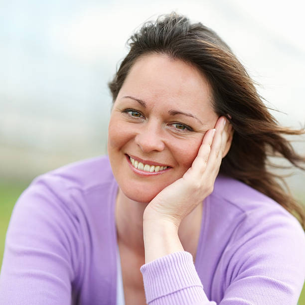 istock Woman with hair blowing in wind 453490853