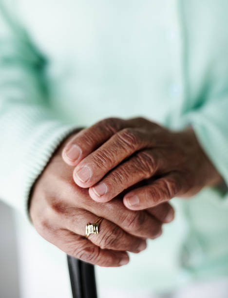 istock Senior woman's hand on a walking stick 453490987