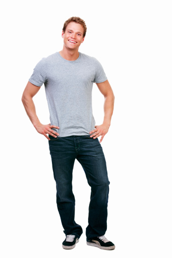Happy young guy standing against isolated white background