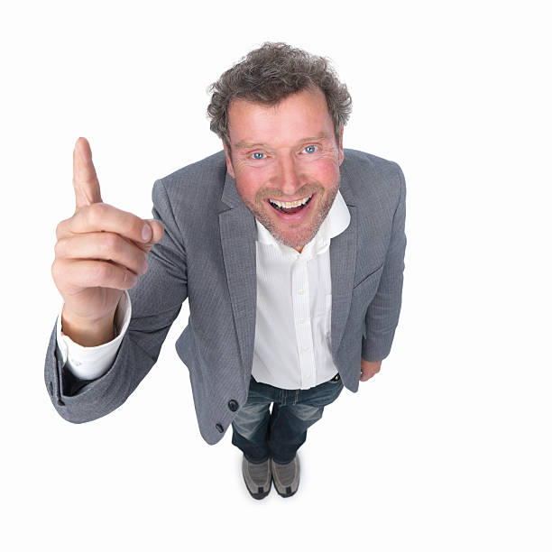 istock Happy businessman pointing up isolated 453491531