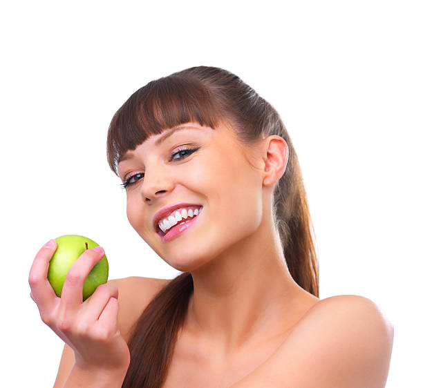 istock Girl holding a green apple 453494071