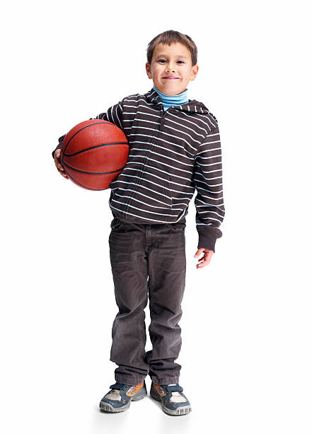 istock Asian kid holding basketball isolated on white 453494237