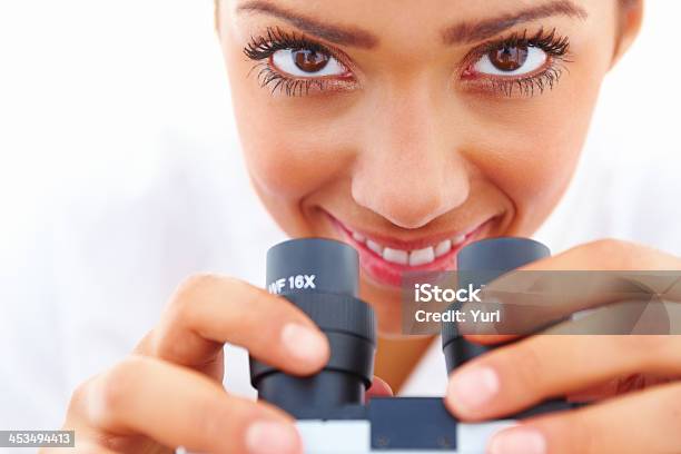 Closeup Portrait Of A Happy Girl Holding A Microscope Stock Photo - Download Image Now