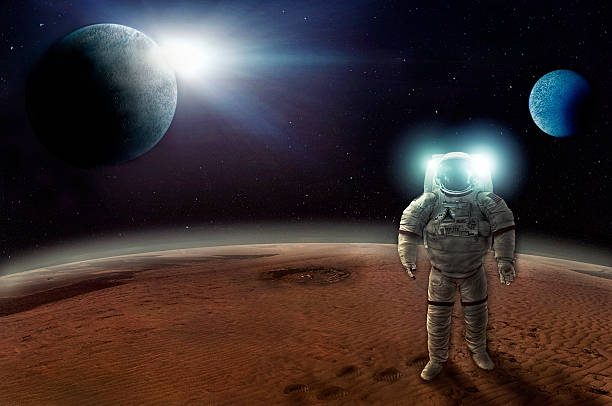 istock Astronaut walks alone on the surface of a planet 453494619