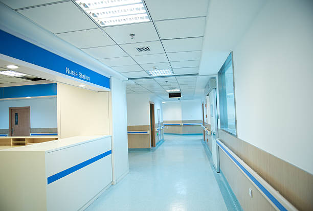 istock An empty hospital hall with a nurse station at left 453494625
