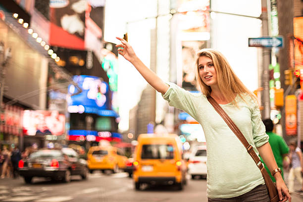 istock Calling a taxi on times square - NYC 453494929