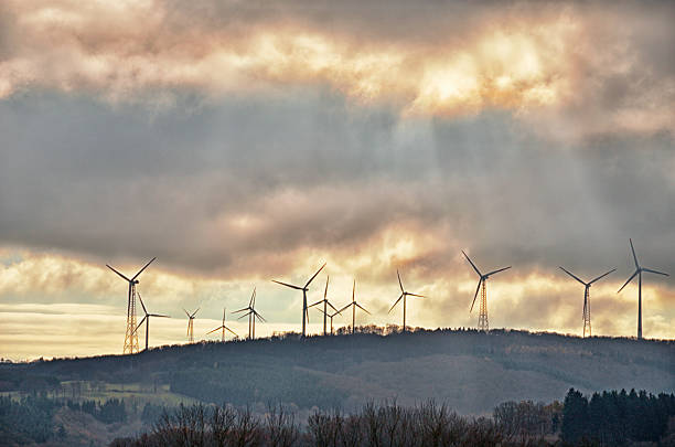 istock Sustainable energy wind turbine on hill 453496229